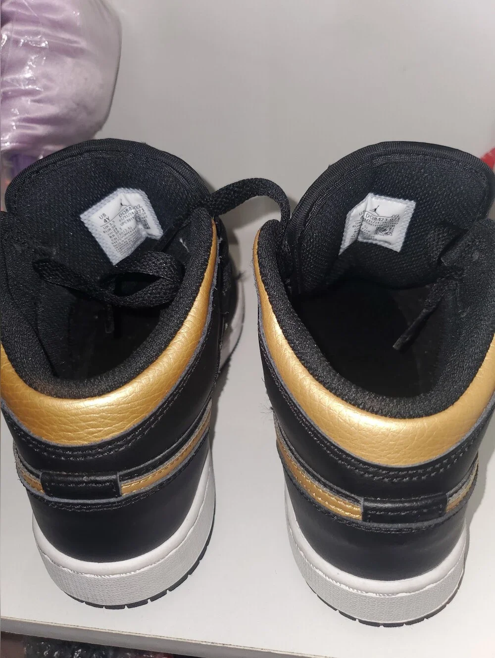 Nike Air Jordan 1 Mid Black/Gold Low-Top Sneakers